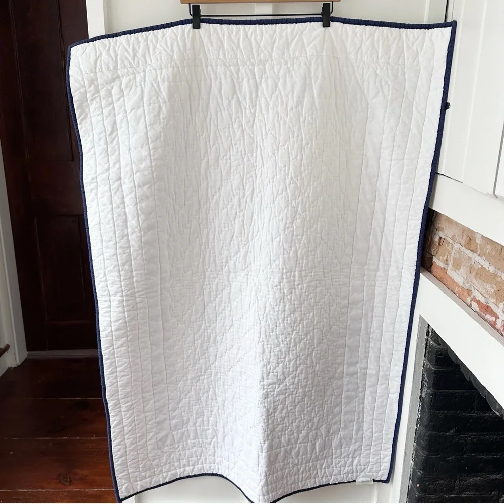 POTTERY BARN KIDS white Harper navy trim baby quilt